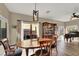 Bright dining room with hardwood floors and large windows at 9916 Fallowdeer Ct, Las Vegas, NV 89149