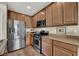 Modern kitchen with stainless steel appliances and island at 9916 Fallowdeer Ct, Las Vegas, NV 89149