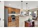 Modern kitchen with stainless steel appliances and island at 9916 Fallowdeer Ct, Las Vegas, NV 89149