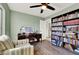 Bright home office features a large desk and extensive shelving at 9916 Fallowdeer Ct, Las Vegas, NV 89149