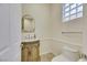 Elegant powder room with a pedestal sink and toilet at 10275 Tresor Ct, Las Vegas, NV 89135