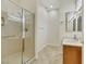 Bathroom with shower, vanity, and tiled floors at 10275 Tresor Ct, Las Vegas, NV 89135