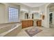 Spa-like bathroom with soaking tub and double vanity at 10275 Tresor Ct, Las Vegas, NV 89135