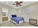 Bright bedroom with ensuite bathroom access and tile flooring at 10275 Tresor Ct, Las Vegas, NV 89135