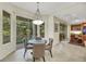 Cozy breakfast nook with a round table and chairs near sliding doors at 10275 Tresor Ct, Las Vegas, NV 89135