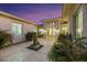 Peaceful courtyard entry with water feature and lush landscaping at 10275 Tresor Ct, Las Vegas, NV 89135