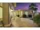 Elegant courtyard entry with stone flooring and lush landscaping at 10275 Tresor Ct, Las Vegas, NV 89135