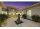 Inviting courtyard entry featuring a water fountain and mature plants at 10275 Tresor Ct, Las Vegas, NV 89135