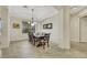 Bright dining room with hardwood floors and a large chandelier at 10275 Tresor Ct, Las Vegas, NV 89135