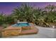 Enjoy a luxurious hot tub and waterfall feature in this private backyard oasis at 10275 Tresor Ct, Las Vegas, NV 89135