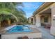 Inviting hot tub surrounded by lush landscaping at 10275 Tresor Ct, Las Vegas, NV 89135