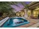 Enjoy the peaceful ambiance of this hot tub overlooking the backyard at 10275 Tresor Ct, Las Vegas, NV 89135