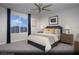 Secondary bedroom with plush bedding and mountain views at 10937 Cilantro Ave # Lot 102, Las Vegas, NV 89166