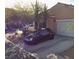 Attached garage with driveway and landscaping at 1173 Stormy Valley Rd, Las Vegas, NV 89123