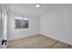 Light-filled bedroom featuring wood-look floors at 1208 Clairemont St, Las Vegas, NV 89110