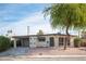 Mid-century modern home with carport and mature tree at 1208 Clairemont St, Las Vegas, NV 89110