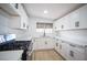 Renovated kitchen featuring white cabinets, quartz countertops, and stainless steel appliances at 1208 Clairemont St, Las Vegas, NV 89110