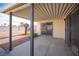 Covered patio with concrete flooring and access to backyard at 1208 Clairemont St, Las Vegas, NV 89110