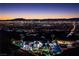 Night view of house with cityscape in the background at 1610 Hardrock St, Las Vegas, NV 89156