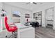 Modern home office with a red chair and built-in storage at 1610 Hardrock St, Las Vegas, NV 89156