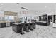 Modern kitchen with large island, stainless steel appliances, and marble countertops at 1610 Hardrock St, Las Vegas, NV 89156