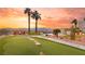 Landscaped backyard with putting green, offering scenic views at 1610 Hardrock St, Las Vegas, NV 89156