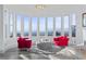 Bedroom sitting area with panoramic views and comfy red armchairs at 1610 Hardrock St, Las Vegas, NV 89156