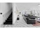 Modern staircase with black marble steps and white walls at 1610 Hardrock St, Las Vegas, NV 89156