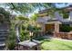 Beautiful outdoor kitchen and bar area with manicured landscaping at 1635 Liege Dr, Henderson, NV 89012