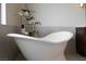 Free-standing tub with a modern faucet and decor at 1635 Liege Dr, Henderson, NV 89012