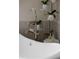 Bathroom with free-standing tub and orchids at 1635 Liege Dr, Henderson, NV 89012