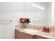 Bathroom featuring vanity with tile backsplash and a large mirror at 1635 Liege Dr, Henderson, NV 89012