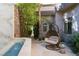 Relaxing courtyard with water feature, bamboo, and hanging chair at 1635 Liege Dr, Henderson, NV 89012