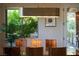 Bright dining room with modern light fixture and backyard view at 1635 Liege Dr, Henderson, NV 89012