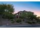 Luxury home exterior with landscaping and hillside setting at 1635 Liege Dr, Henderson, NV 89012