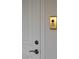 Elegant interior door with brass elevator button at 1635 Liege Dr, Henderson, NV 89012