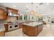 Spacious kitchen featuring an island, stainless steel appliances, and pendant lighting at 1635 Liege Dr, Henderson, NV 89012