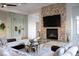 Living room with a contemporary fireplace and comfortable seating area at 1635 Liege Dr, Henderson, NV 89012