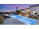 Beautiful pool and spa with lounge chairs, overlooking the city lights at 1635 Liege Dr, Henderson, NV 89012