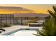 Inviting pool area with beautiful sunset views and comfortable lounging at 1635 Liege Dr, Henderson, NV 89012