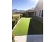 Landscaped backyard with artificial turf and mountain views at 1736 Williamsport St, Henderson, NV 89052