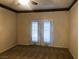 Bedroom with double doors and carpet flooring at 1736 Williamsport St, Henderson, NV 89052