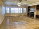 Spacious living room with large windows and tile floors at 1736 Williamsport St, Henderson, NV 89052