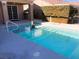 Inviting swimming pool with a dolphin statue and patio at 1736 Williamsport St, Henderson, NV 89052