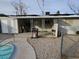 Backyard with covered patio, pool, and storage shed at 1920 Walnut Ave, Las Vegas, NV 89101