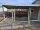 Covered patio with concrete flooring, metal fencing, and a bench at 1920 Walnut Ave, Las Vegas, NV 89101