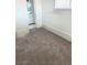 Small bedroom with gray carpet and access to bathroom at 1920 Walnut Ave, Las Vegas, NV 89101