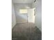 Small bedroom with gray carpet and a door at 1920 Walnut Ave, Las Vegas, NV 89101