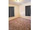 Bedroom with gray carpet and two windows at 1920 Walnut Ave, Las Vegas, NV 89101