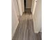 Hallway with gray vinyl flooring and access to other rooms at 1920 Walnut Ave, Las Vegas, NV 89101